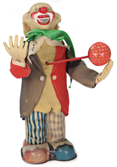Jouet à batterie, clown jonglant avec ballon