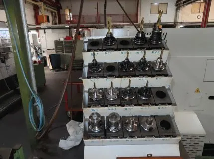 15 tool holders, some with tool in the tool rack