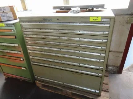 1 tool cabinet, approx. 100 x 60 x 100 cm, 9 drawers, contents: various documents, calipers, milling cutters etc.