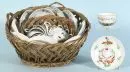 Teacups, 11 pieces and 10 saucers – porcelain, hand-painted, rose motifs, 5 cups with monograms and sayings, in 2 woven baskets, East Frisia