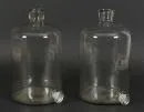 Récipients de pharmacie, 2 pièces – verre incolore, corps cylindrique avec bec verseur en bas, H= 32 cm