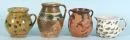 Potter's ware, 4 pieces - jugs with handle – ceramic, various shapes and decors, H= 11-18 cm, 1 with chip on rim;