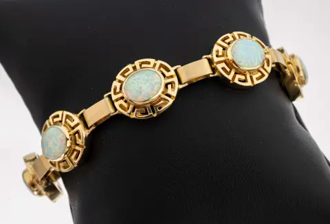 Bracelet or 14 kt pierres de couleur, or 585/000, maillons ovales motif méandre, 7 ovales
