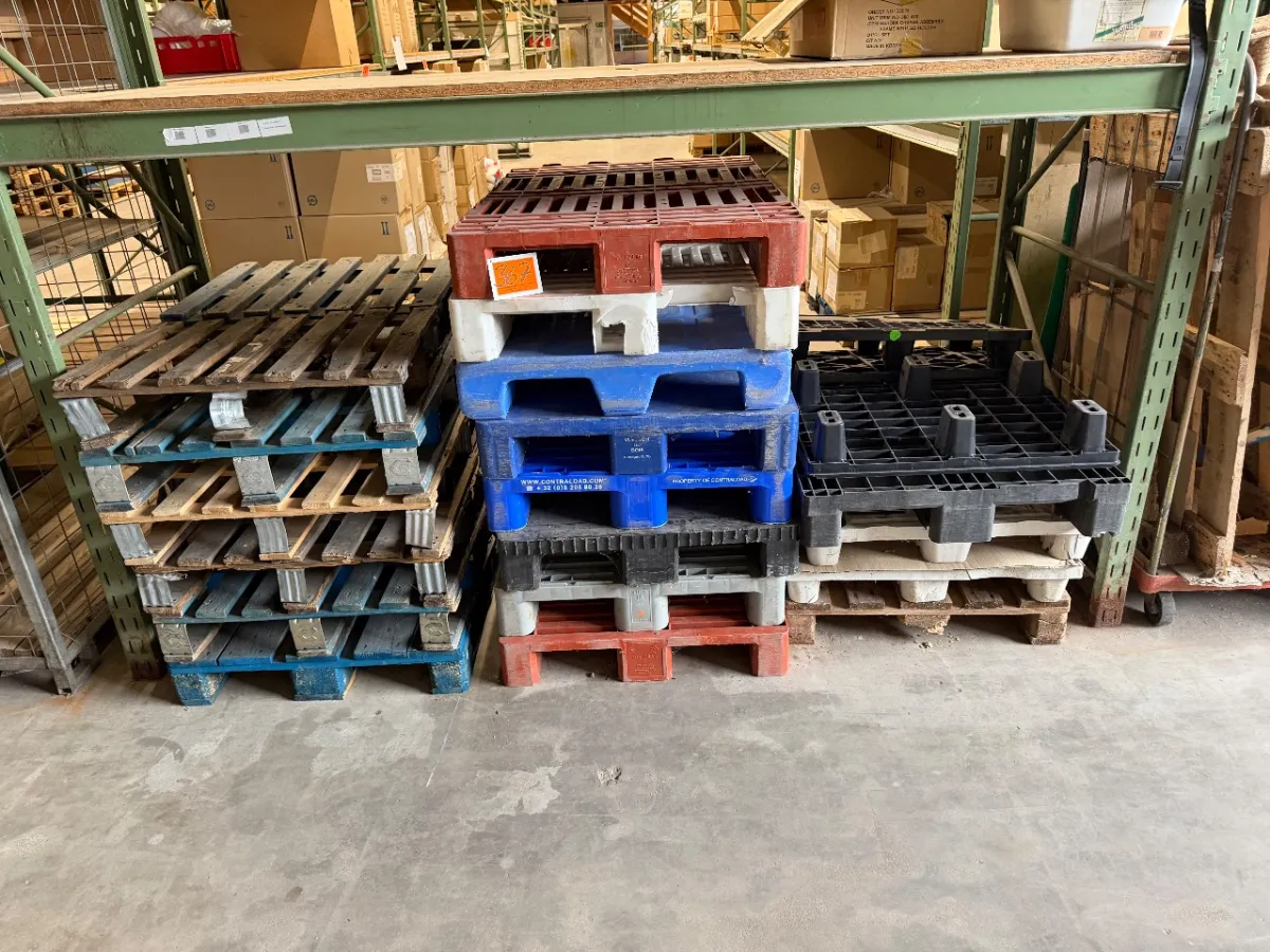 Lot of wooden and plastic pallets