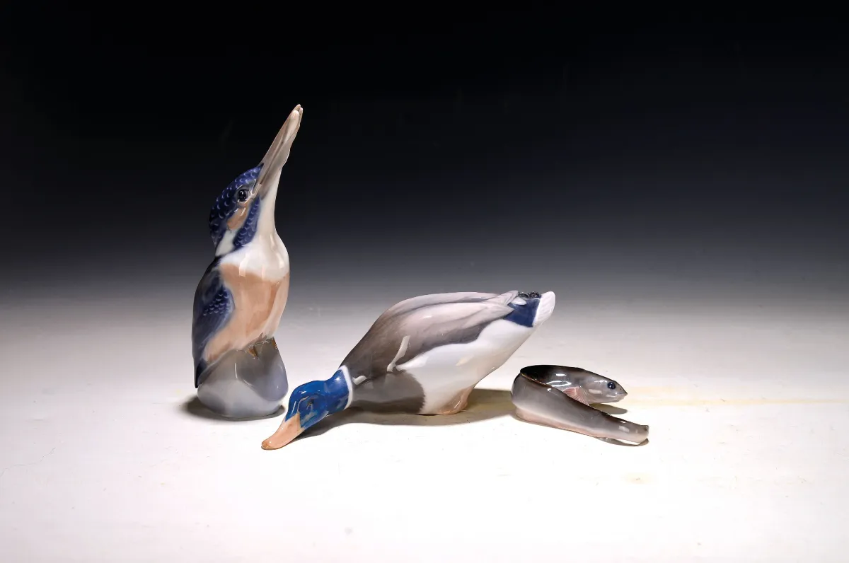 Three porcelain figurines, Royal Copenhagen, 2nd half 20th c., kingfisher with caught fish,