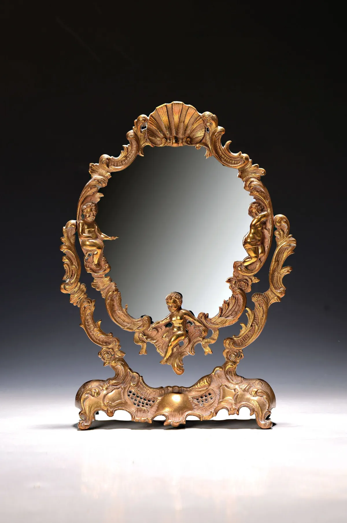 Miroir de table historicisant, 1re moitié 20e s., bronze, pivotant, décor rocaille