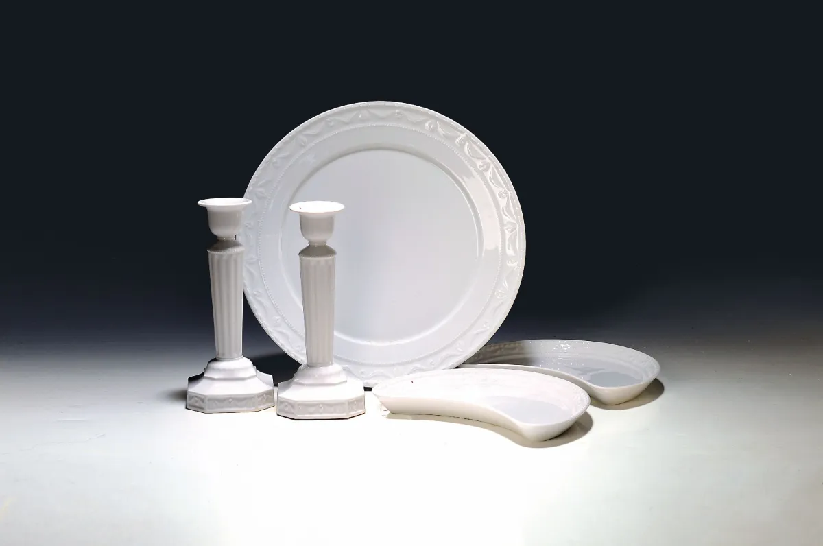 12 table objects Kurland, KPM, Berlin, after 1945, white porcelain, 8 crescent plates