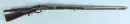 Fusil à percussion – crosse en noyer avec décorations sculptées et bague en laiton, pontet sculpté en bois, canon en acier rond, L= 129 cm, fin 18e s.