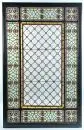 Vitrail – éclats de verre incolores et colorés (en partie renouvelés), décor d'ornements et de bandes, dans cadre en bois ébonisé, total 172,5 x 116 cm