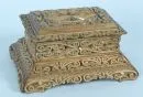 Lidded casket – wood, lacquered and with gold flakes, richly carved ornaments, wide base, green fabric inside, 13 x 28 x 21 cm;