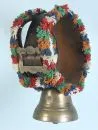 Cowbell – bronze, on leather strap with metal buckle and colorful wool fringes, H= 43 cm;