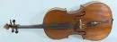 Musikinstrument - Cello – Holzkorpus mit ebonisiertem Steg, H= 126 cm, Gebrauchsspuren, ohne Bogen, mit Koffer;