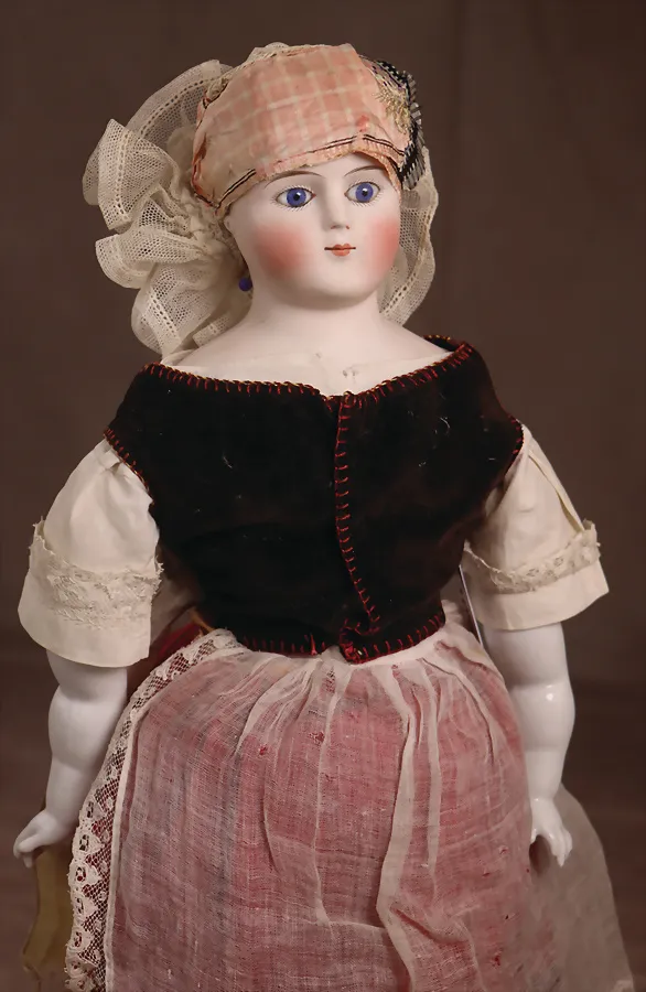 Poupée tête en porcelaine biscuit avec plaque de poitrine