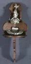 Wall lavabo – tin container and basin, shaped as putto on a fish (damaged), with wooden corner bracket, brown stained, curved shape, H= 114 cm, tail fin re-carved in wood