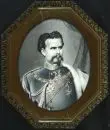 Lithographie, 19e s. – coloriée à la main, découpe ovale 54 x 42 cm, "Roi Louis II", dans un cadre octogonal décoré;