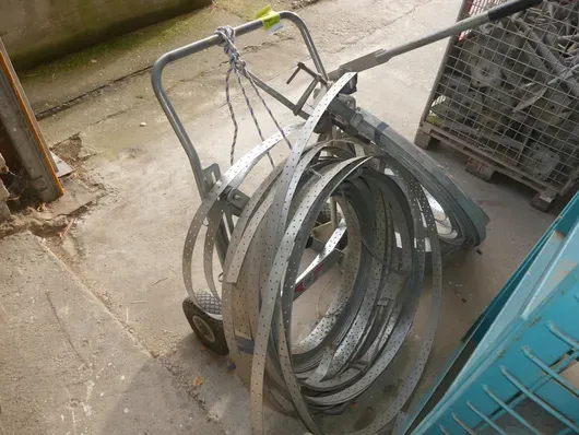 Wind bracing strap with dispenser