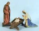 Figurines de crèche, 3 pièces - Sainte Famille – papier mâché/lin, amidonné et polychrome, têtes et mains en cire, Enfant Jésus en cire, couché dans la crèche, H= 10-38 cm