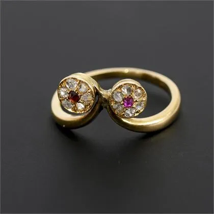 Unusual Art Nouveau ring with red stones and diamonds