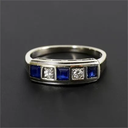 Art Deco ring with blue coloured stone squares, probably sapphire, and brilliants