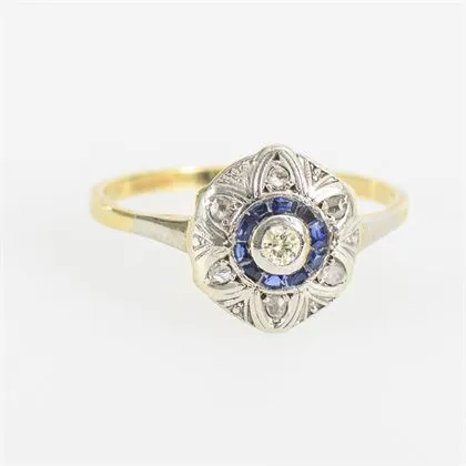 Round Art Deco ring with blue coloured stones and brilliant