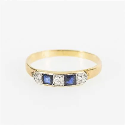 Ring set with blue square stones, probably sapphires, and old-cut diamonds