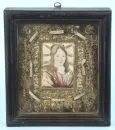 Reliquary frame, 18th c. – central watercolor with portrait of a saint, surrounded by rich convent work in gold and silver wire, 8 relics