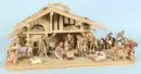 Weihnachtskrippe – Holz, 29 x 70 x 29 cm, mit 16 farbig gefassten Holzfiguren, H= 3,5-12,5 cm;