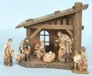 Crèche de Noël – bois teinté brun, 22 x 23 x 12 cm, avec 6 figurines en bois polychromes, H= 3-10,5 cm