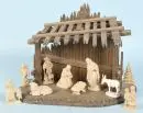 Crèche de Noël – bois teinté brun, 26 x 35 x 19 cm, avec 9 figurines en bois, H= 3-10 cm