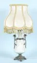 Lampa stołowa – ceramika, jasnozielone szkliwo, biały wypukły motyw z nimfą w trzcinach, korpus baluster, mosiężne okucia