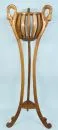 Plant stand – walnut, 3 slender curved legs with carved decorations and swan heads, triangular plate at bottom, flower basket at top