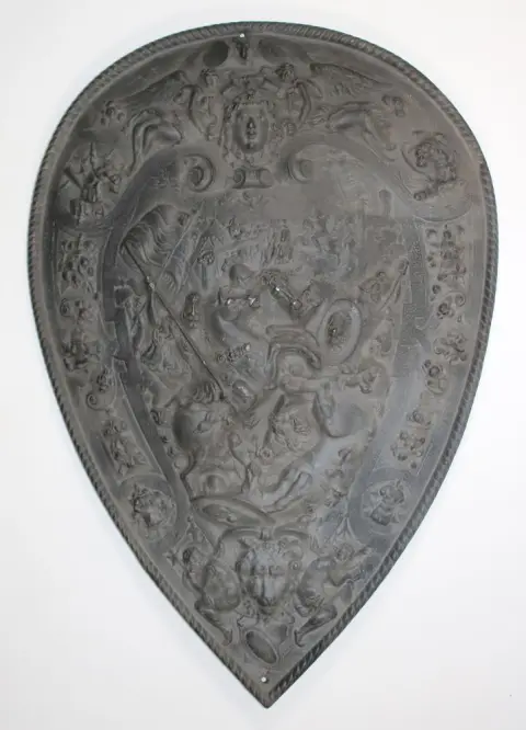 Historicism – iron shield with mascarons and