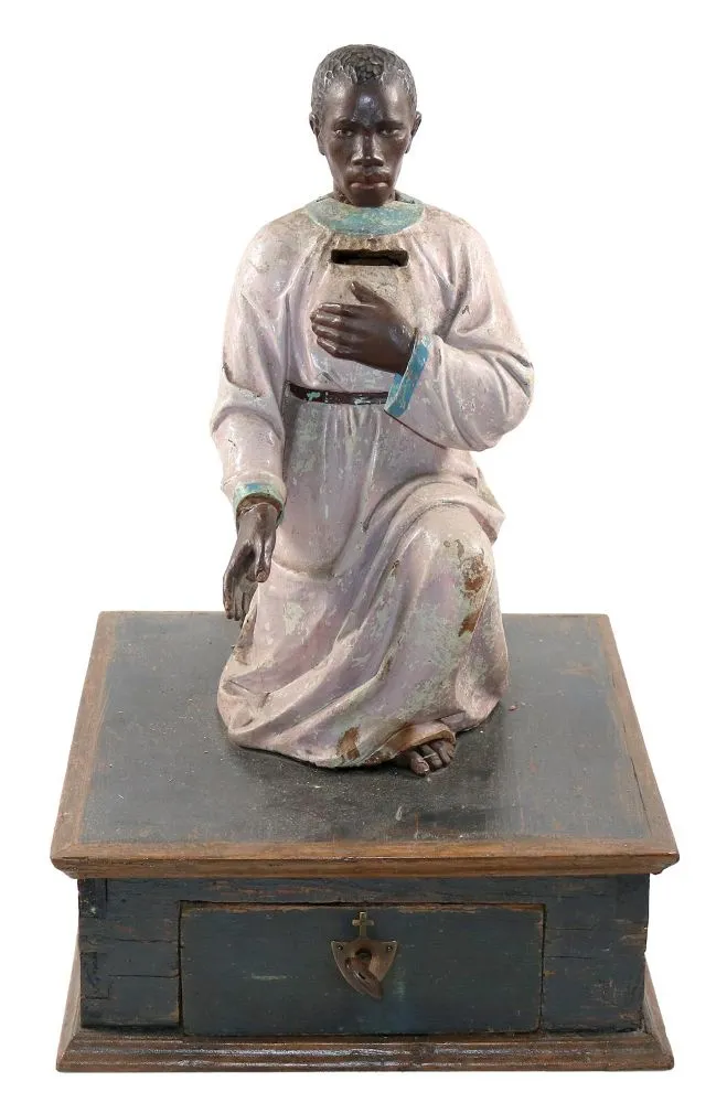 Missionsdose, Wackelkopf. – Dose mit geschnitzter, männlicher, afrikanischer Figur