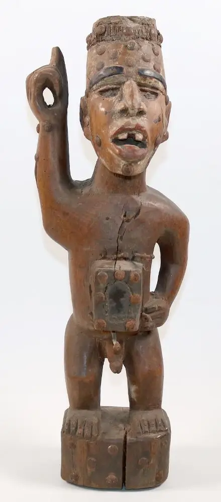 Nkisi, Nkonde magic figure. – Standing figure with glazed belly box