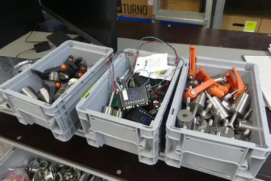 Lot of quick-release adapters, test bench and diagnostic accessories, including storage boxes
