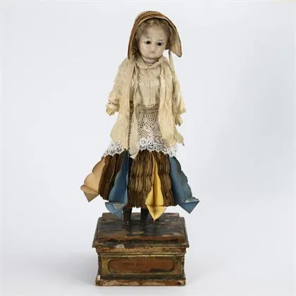 Rare "fortune-telling doll" on wooden base