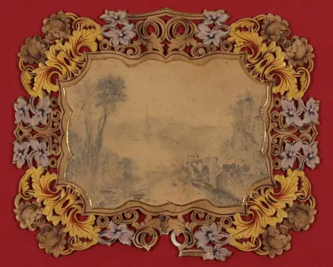 Fireplace fan. – Landscape drawing with staffage figures on wooden fan with floral carving
