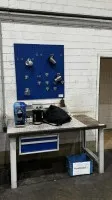 1 workbench Garant with wall shelves and tool pegboard