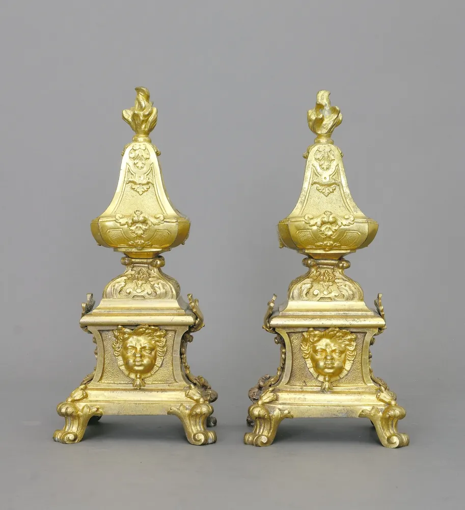 Chenets, bronze, fire-gilt, Paris, circa 1700, a pair attributed to André Charles Boulle (1642 - 1732), H.: 32.5 cm. - Cf. Norée…