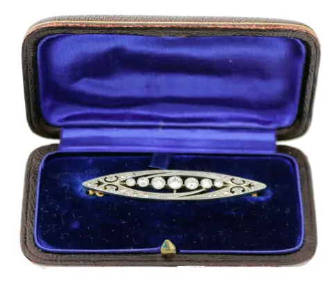 Brož, 585 zlato, částečně rhodiované, tvar loďky Art Deco, osazená 7 malými briliantovými diamanty 0,03 - 0,17 ct.