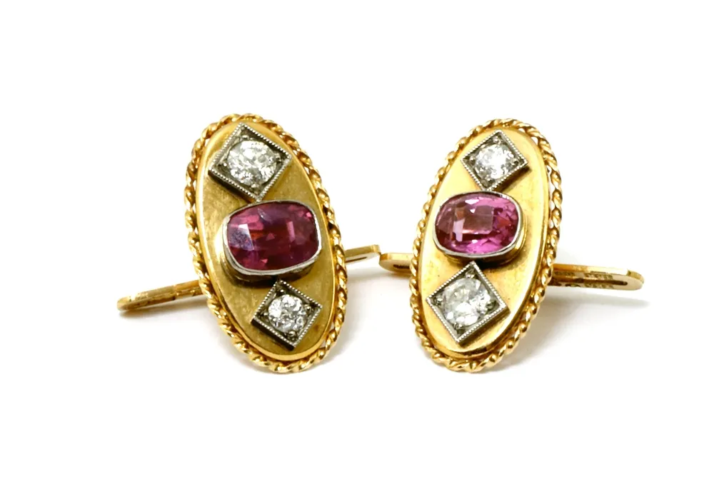 Cufflinks, 750 rose gold assembly, one pair oval, each set with one ruby and two brilliant-cut diamonds of 0.10 ct.