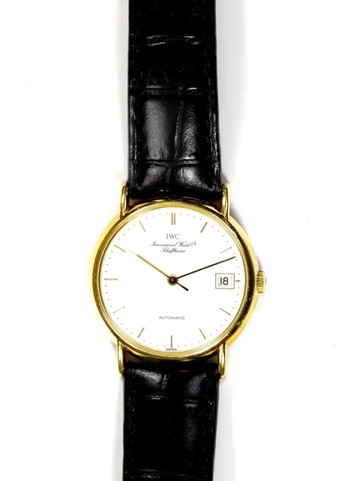 Montre, bracelet, IWC International Watch Co. Schaffhausen boîtier rond doré avec index-chiffres, grande seconde, date à 3h