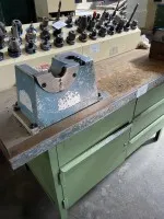 1 workbench with vice, tool assembly stand, tool holders and small tools
