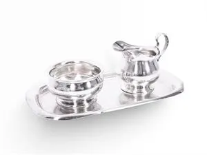 Milk jug and sugar bowl on tray