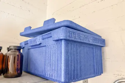 Cool box and serving tongs